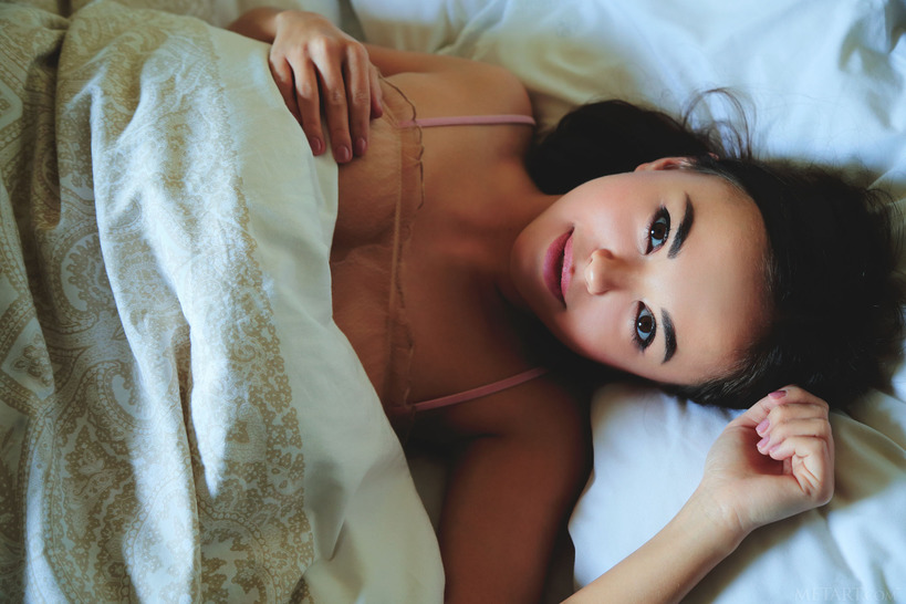 Petite, bespectacled beauty Li Moon reads a book in bed 01